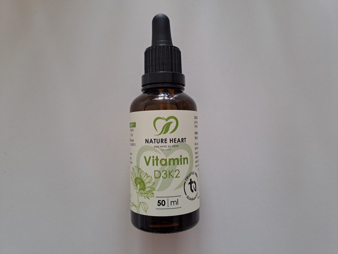 A dropper bottle of Nature Heart Vitamin D3 K2