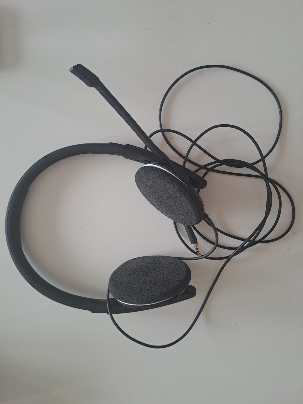 A wired Sennheiser headset with a boom microphone