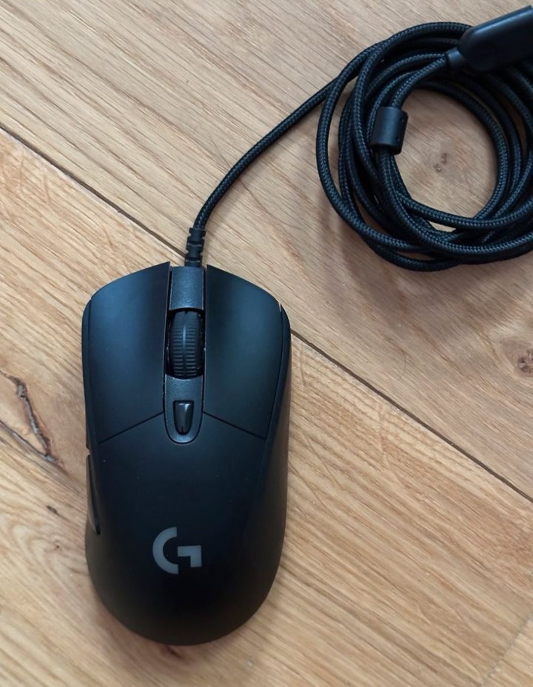 A Logitech G403 wired mouse with braided cable