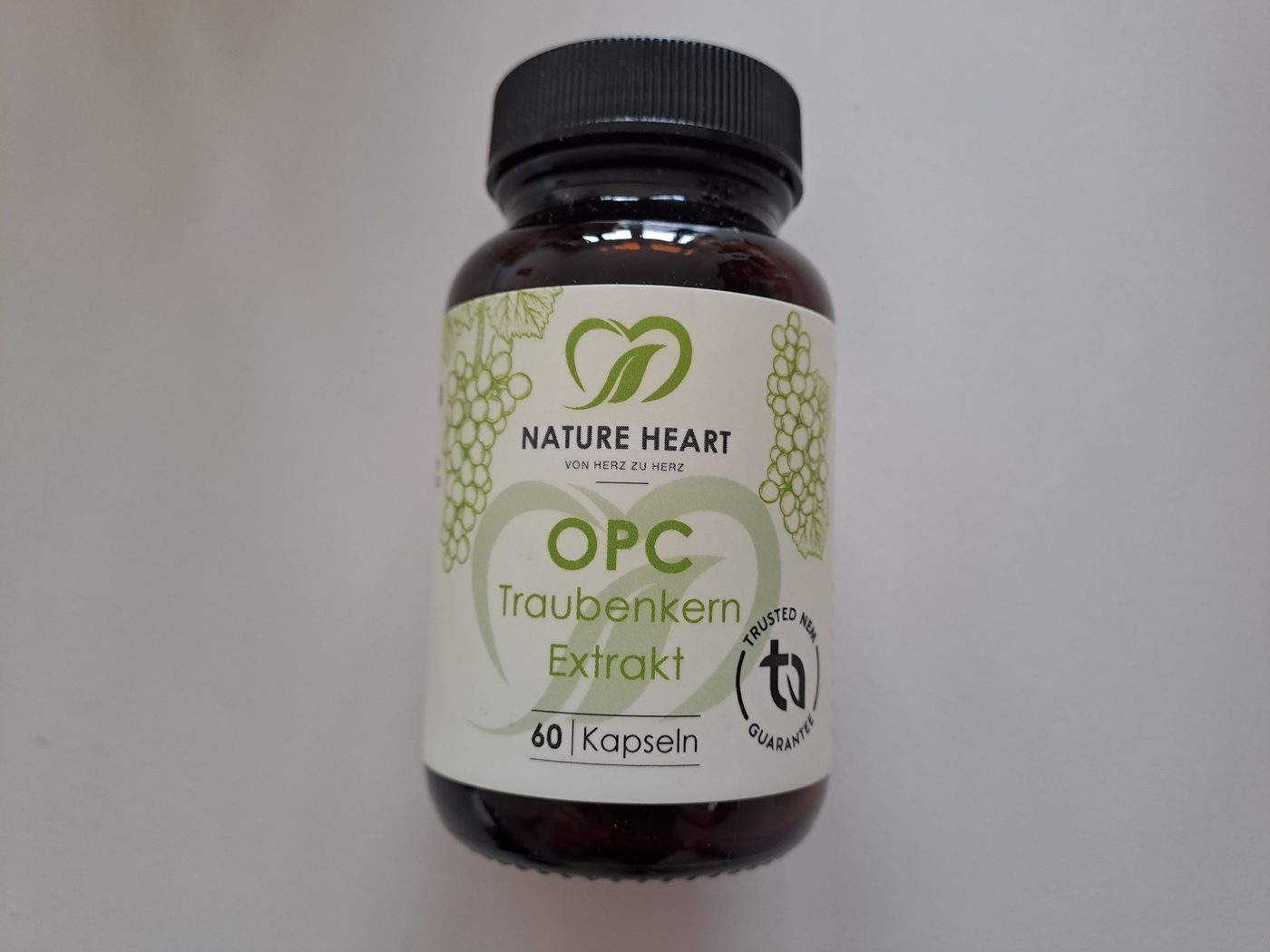 A bottle of Nature Heart OPC grape seed extract capsules